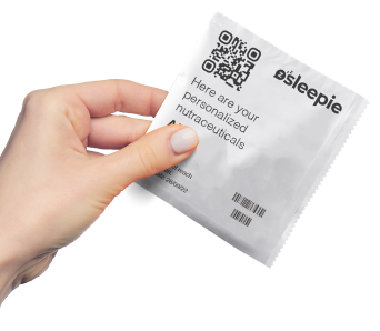 Hand image holding the sleepie capsule packs